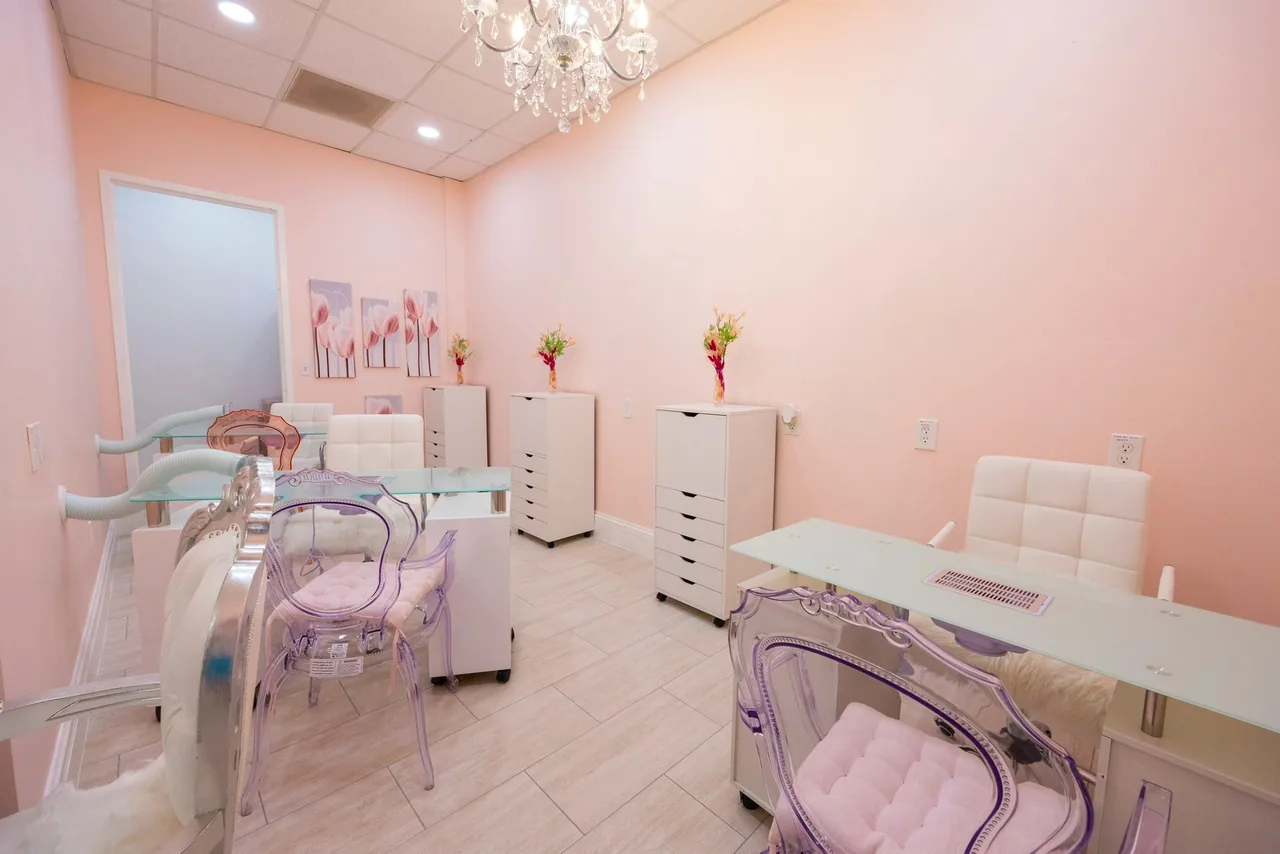 Private treatment room in blush tones where facials and IV therapy are done at The Beauties Salon